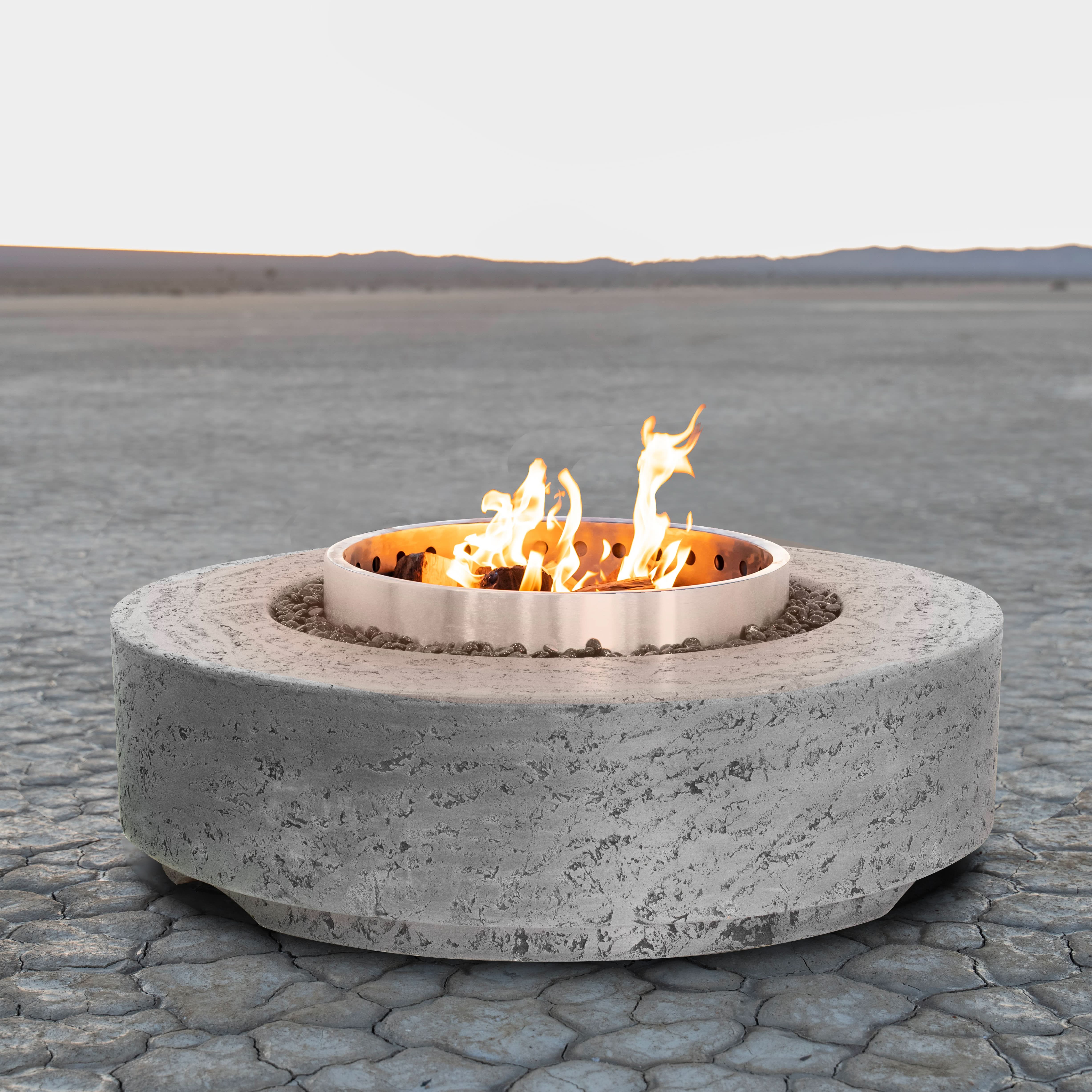 The Outdoor Plus Artemis Smokeless Fire Pit with GFRC concrete top and Corten steel base