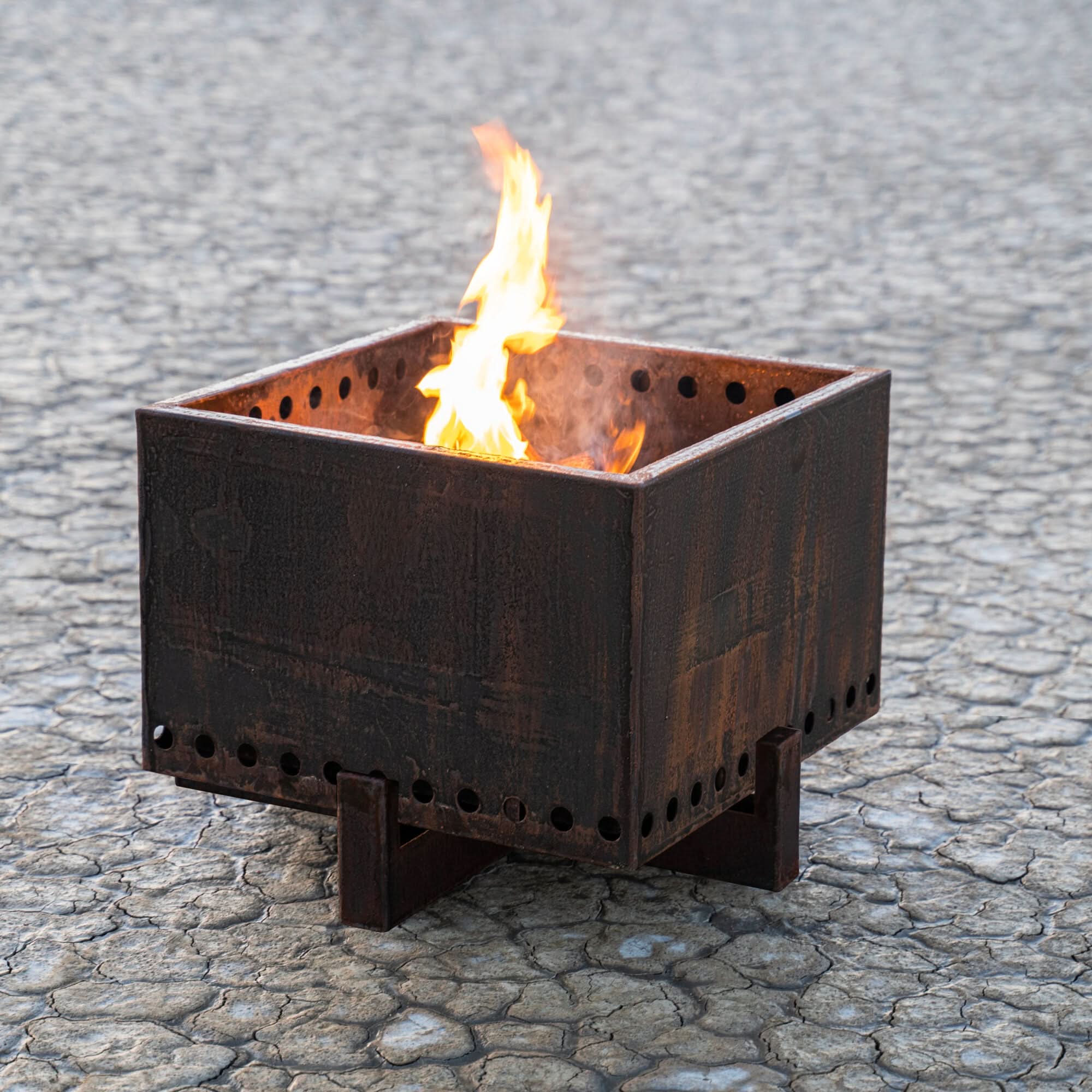 The Outdoor Plus Helix Smokeless Fire Pit in Corten steel for outdoor patios