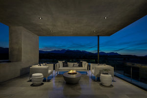 Studio Nisho Nyx GFRC fire feature installed in an outdoor setting