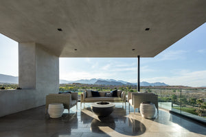 Studio Nisho Nyx GFRC fire feature installed in an outdoor setting