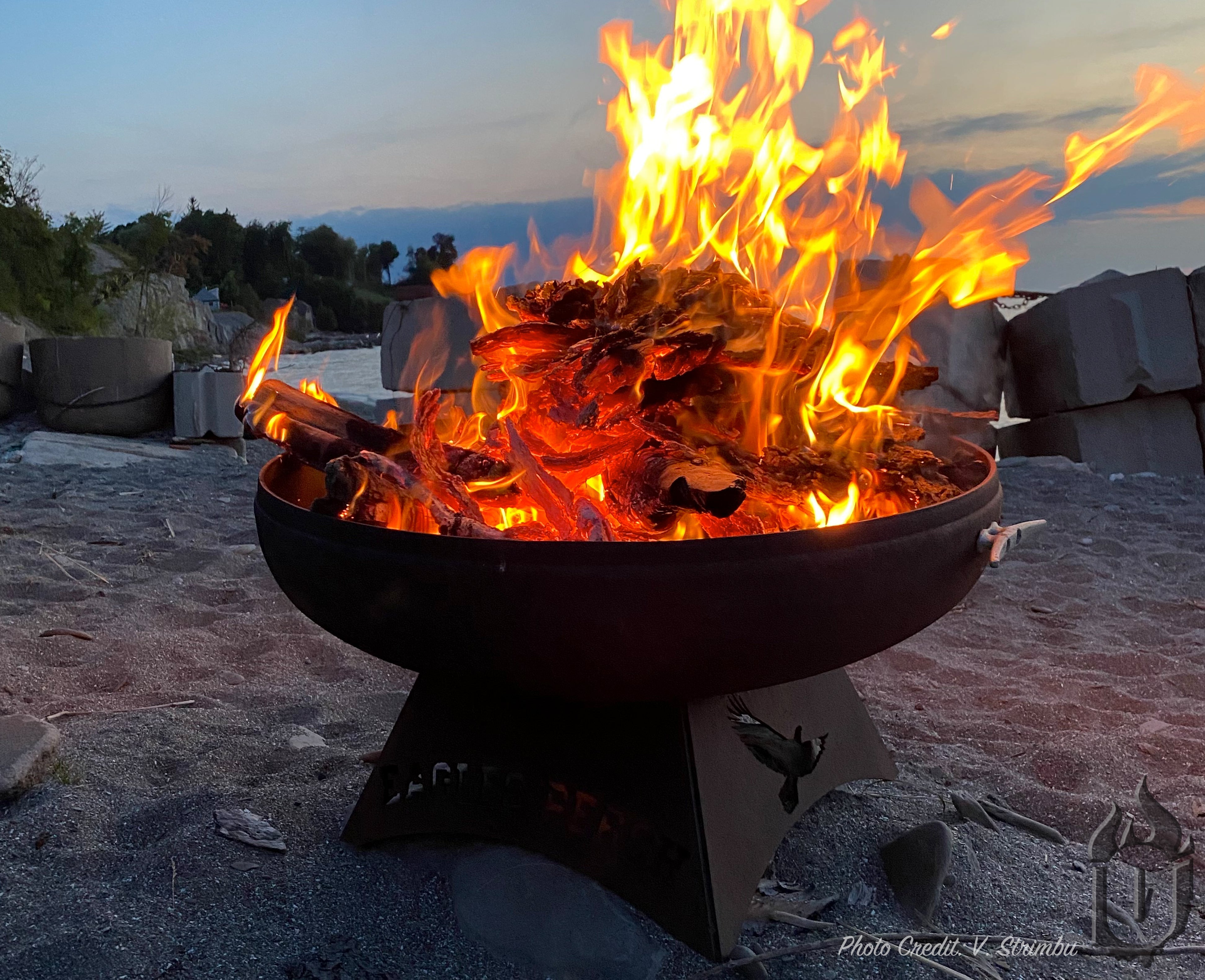A warm fire pit on the beach -smokeforges