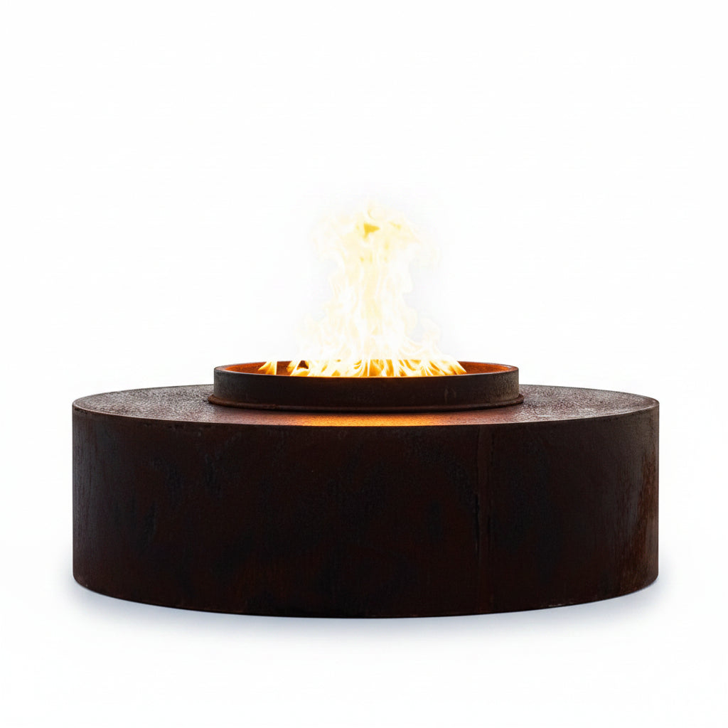 The Outdoor Plus Orbit Corten steel smokeless fire pit with flames at sunset