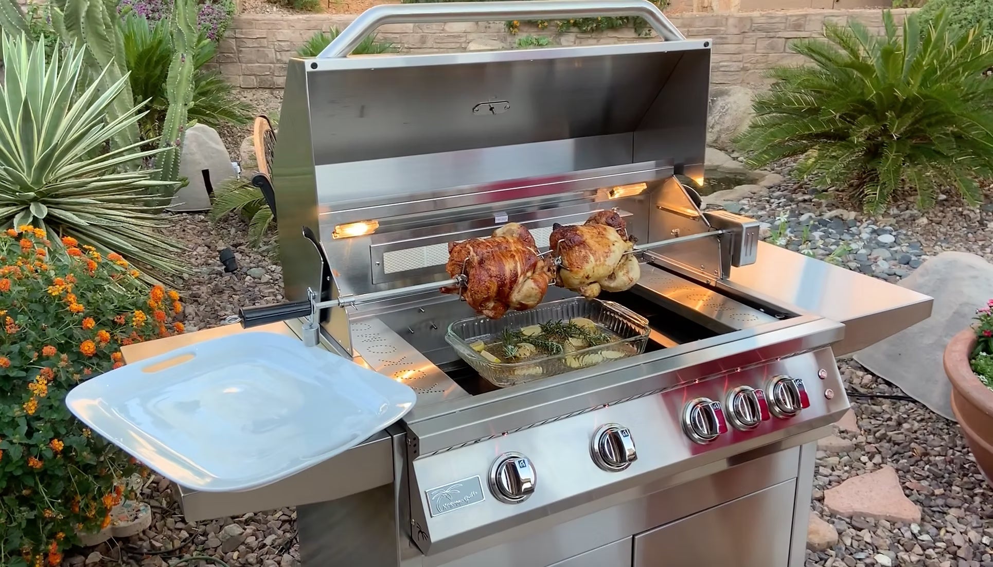 KoKoMo rotisserie kit in use on a backyard grill with rotisserie chickens