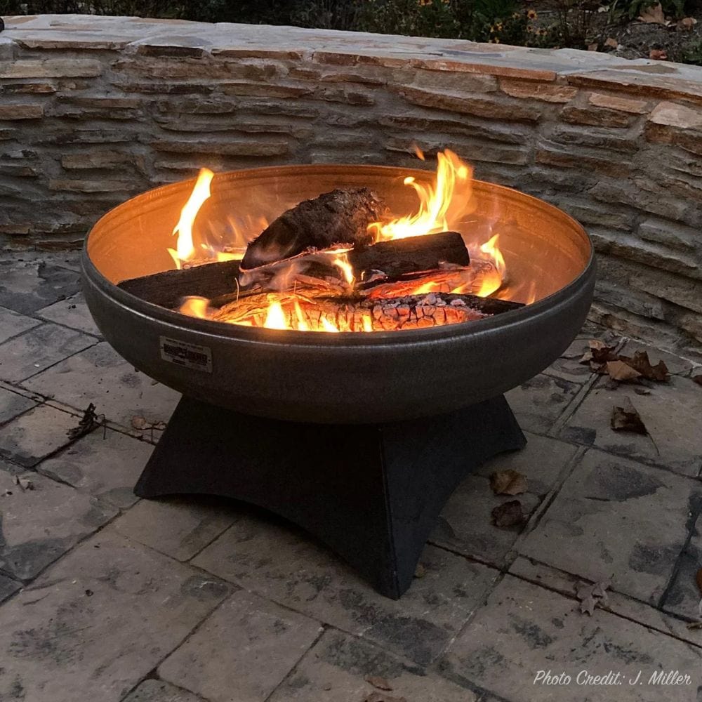 Ohio Flame Liberty fire pit with curved base in a real outdoor backyard setting