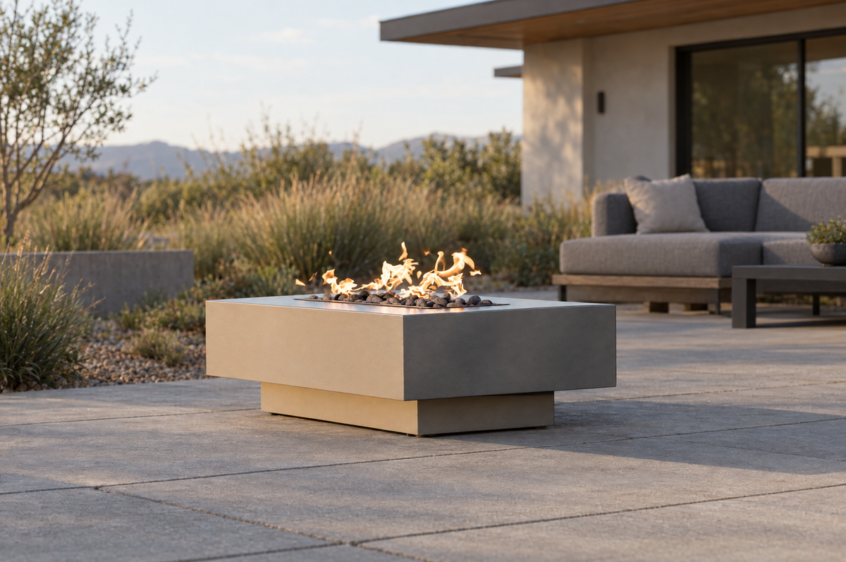 Outdoor Plus Coronado Pewter metal gas fire pit in a patio lounge — illustrative setting