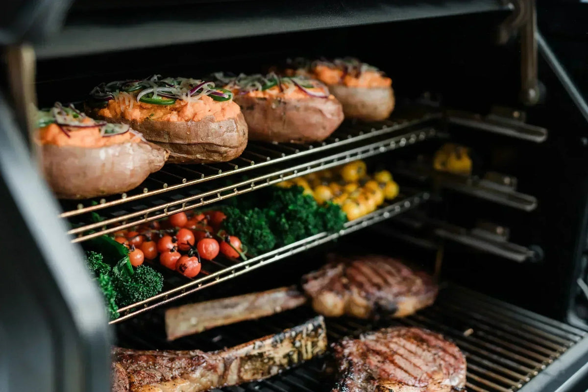 Steaks and vegetables cooking on the Masterbuilt Gravity Series XT