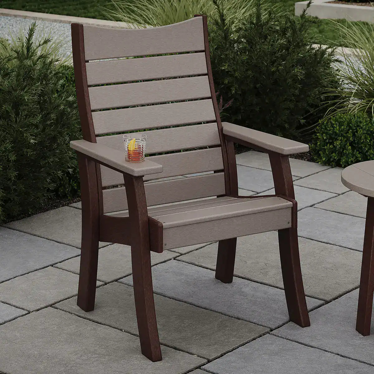 Luxcraft Single-seat Contour bench on a paved patio