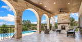 Majestic Castlewood outdoor wood-burning fireplace with natural gray herringbone refractory