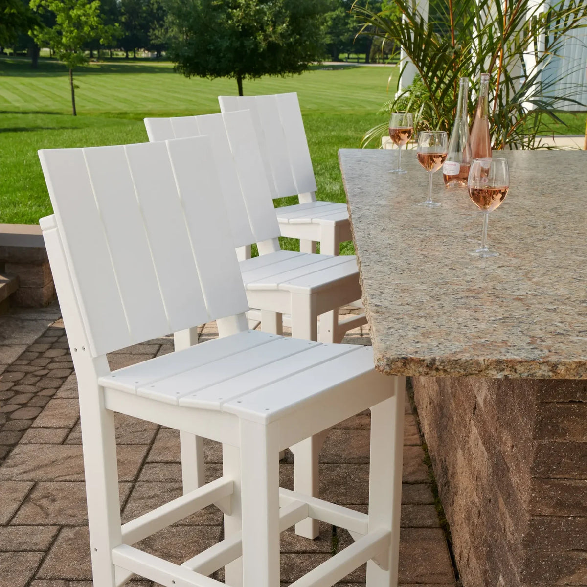 Luxcraft White Urban side chairs at an outdoor table