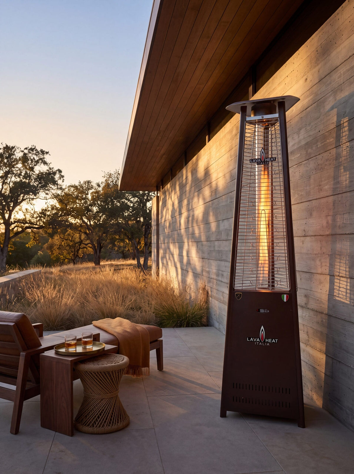 Lava Heat Italia 2G Flame Tower patio heater in Heritage Bronze - outdoor setting