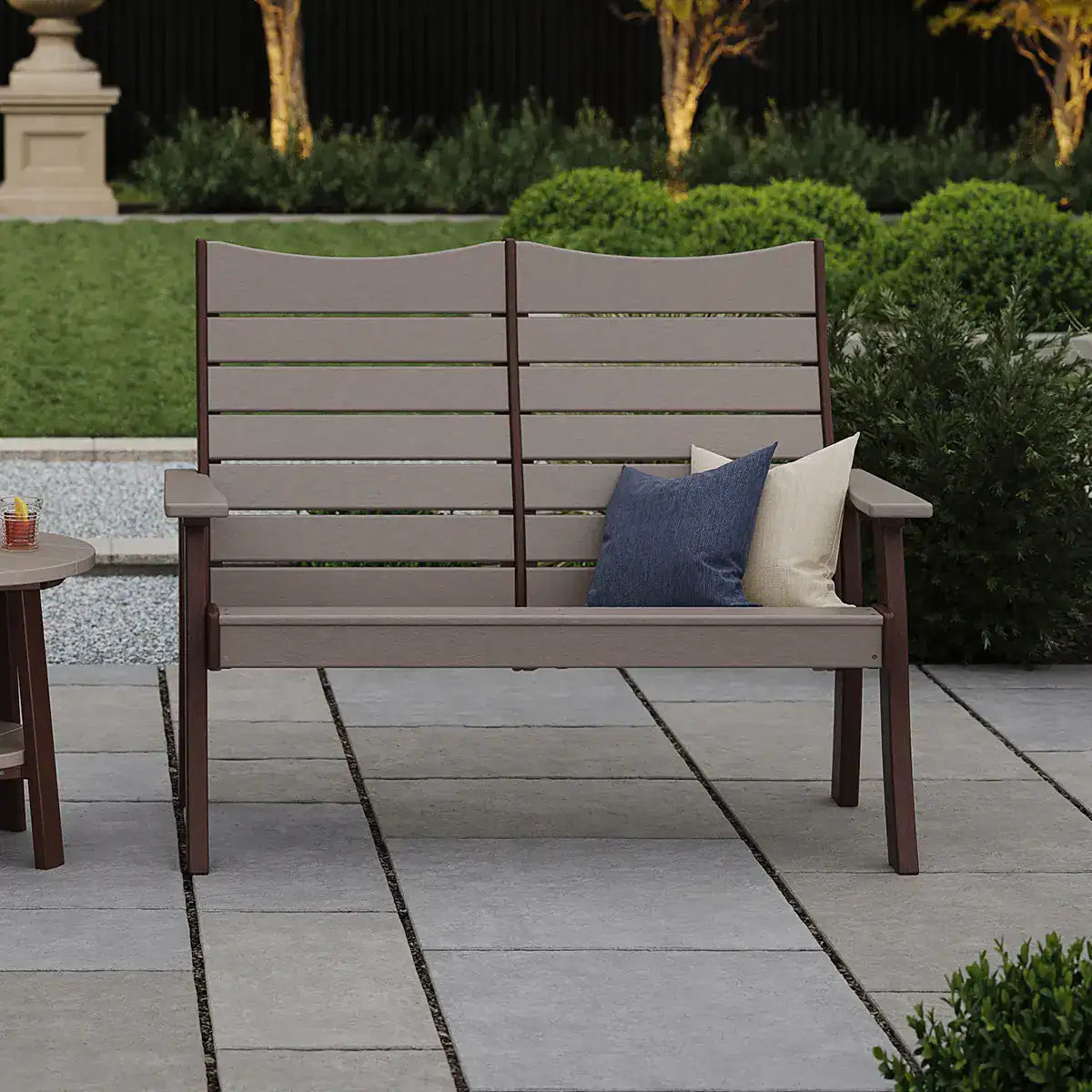 Luxcraft Four-foot Contour bench in a garden setting