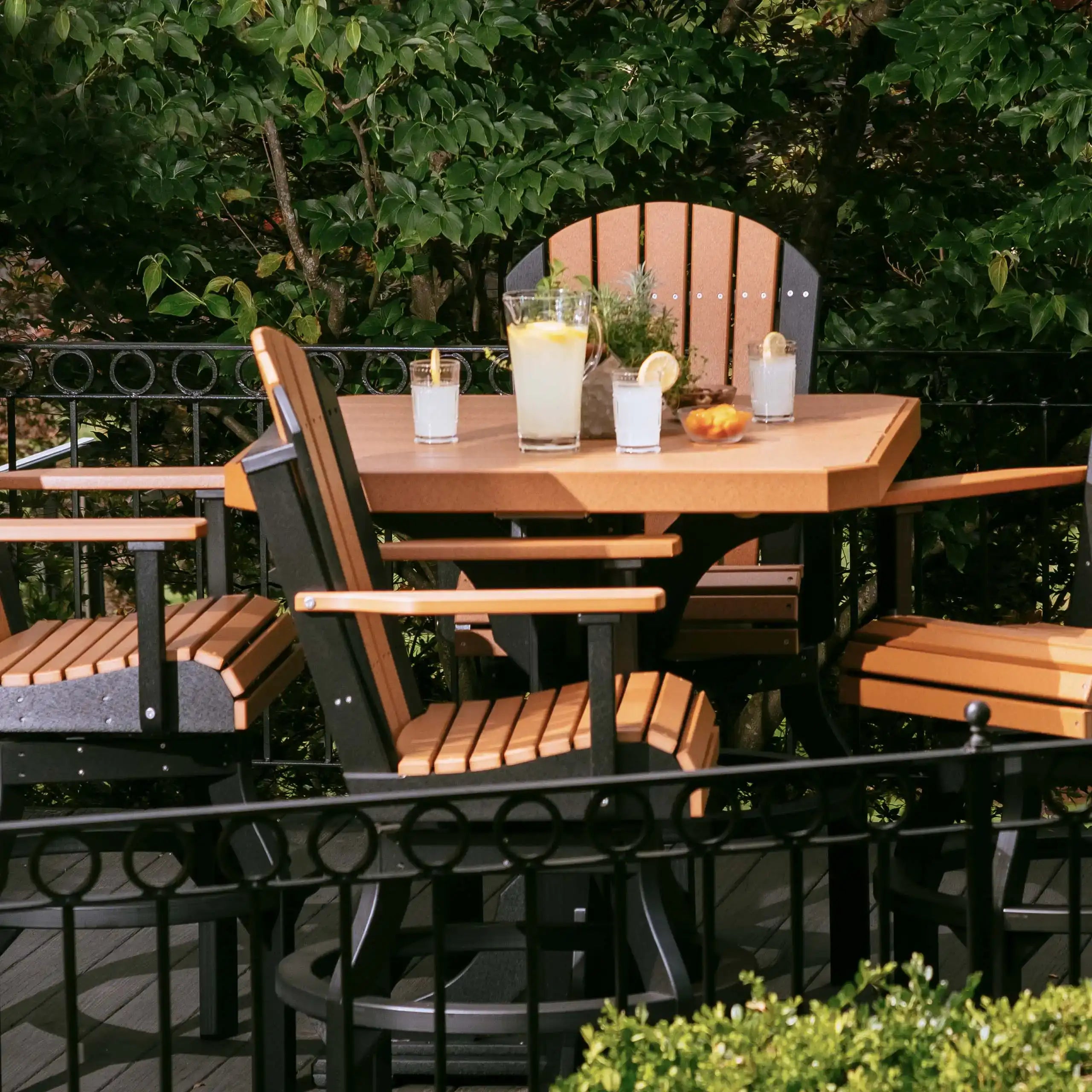 Luxcraft 41-inch square table and chairs beside a garden