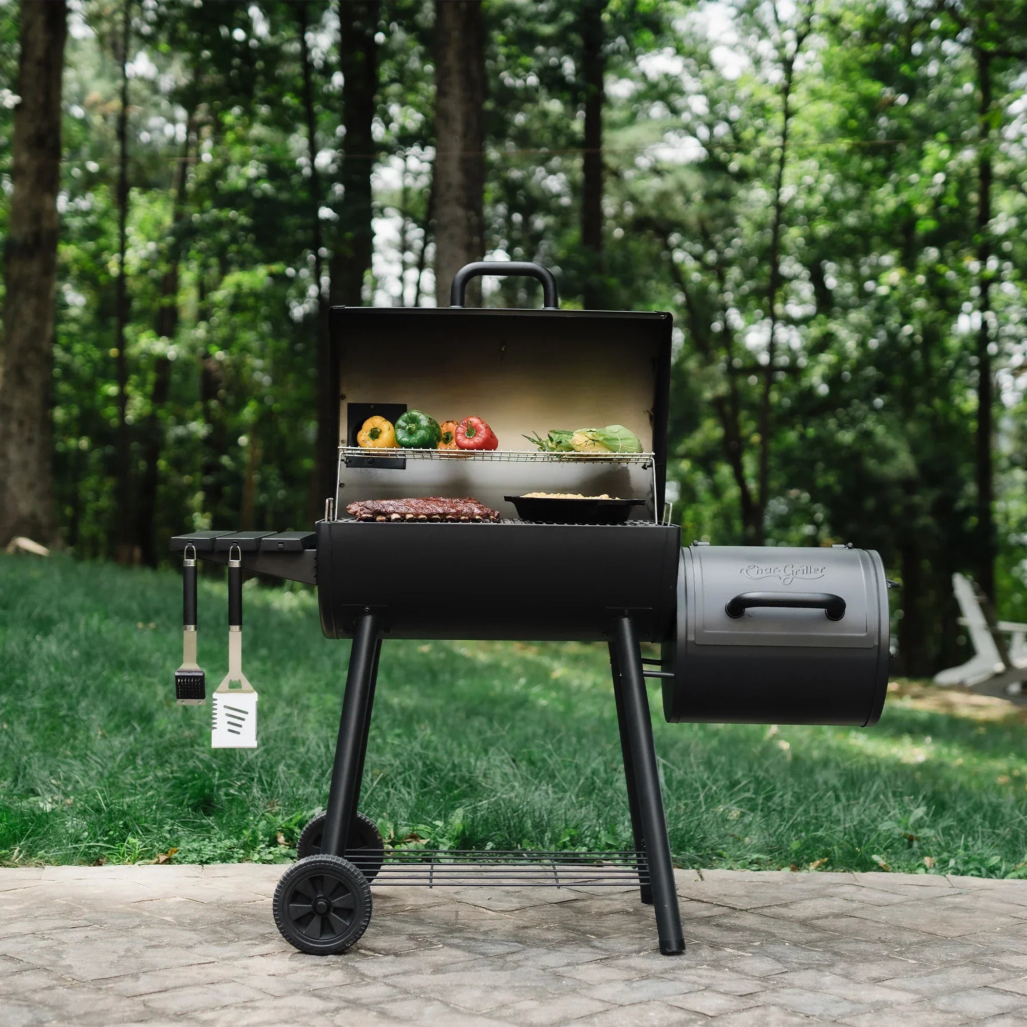 Char-Griller Smokin' Pro CG30044223 barrel grill and offset smoker lifestyle view