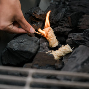 Char-Griller natural wood fire starter being lit