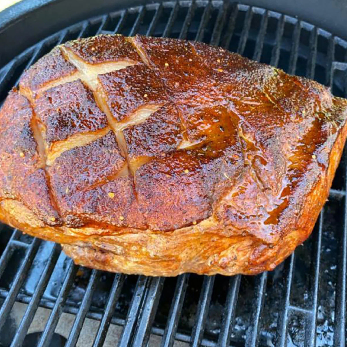 Char-Griller 6205 drip pan in use beneath food on a grill