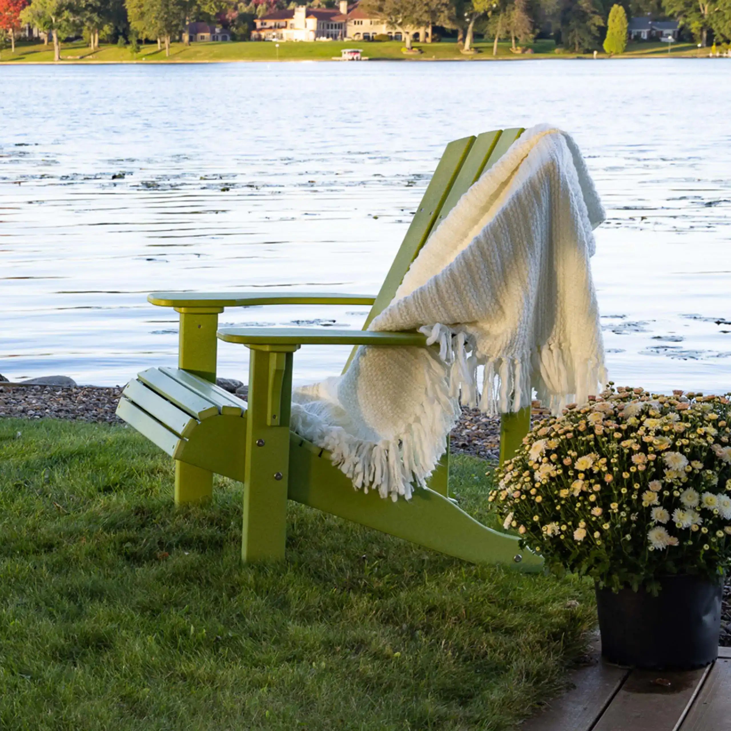 Luxcraft Deluxe Adirondack chair beside the water