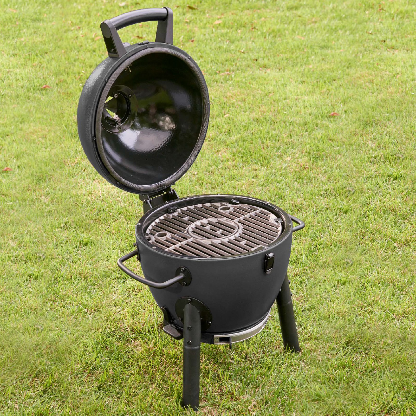 Char-Griller AKORN Jr. E86714 kamado grill open in an outdoor cooking setup