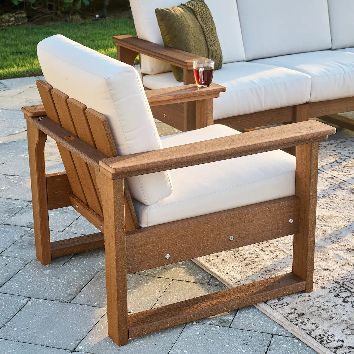 Luxcraft Lanai chair with woodgrain-look frame and light cushions