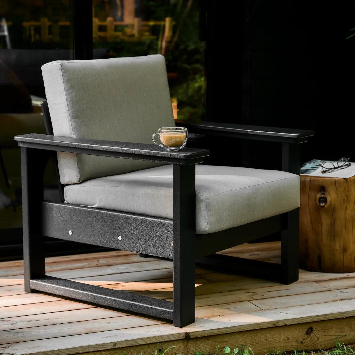 Luxcraft Lanai deep seating chair with dark frame and gray cushions