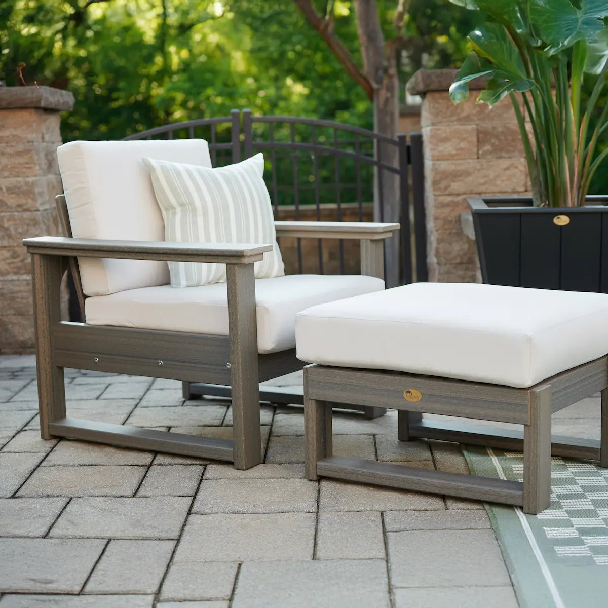 Luxcraft Lanai chair and separately sold ottoman outdoors