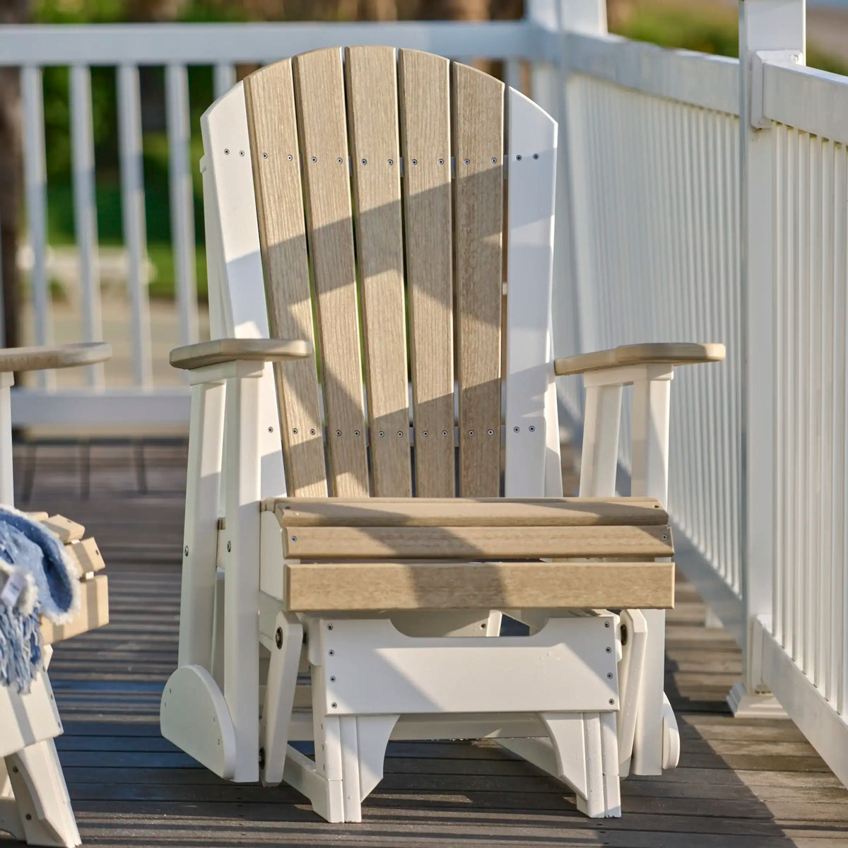 Luxcraft Individual Adirondack glider chair on a porch
