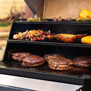 Masterbuilt Gravity Series 1050 Digital Charcoal Grill & Smoker used for outdoor cooking