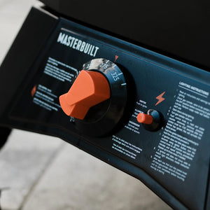 Temperature dial and ignition control on ThermoTemp XL propane smoker