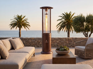 Lava Heat Italia Opus Lite patio heater in Heritage Bronze - outdoor setting