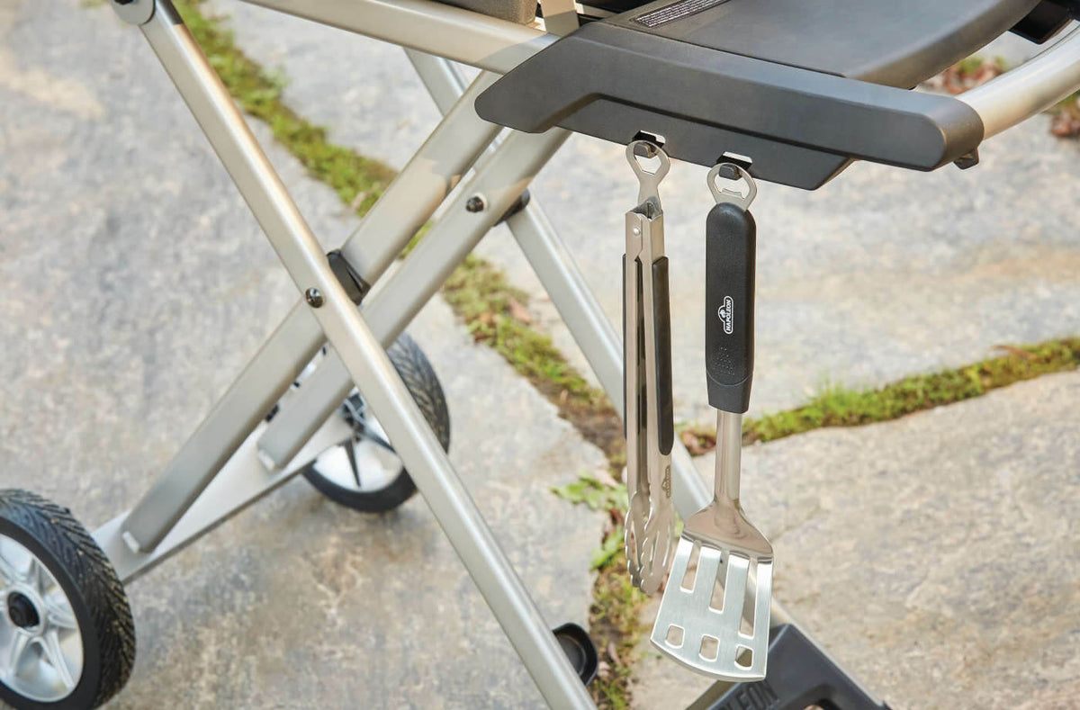 Napoleon TravelQ PRO285X Propane Grill with Scissor Cart - Napoleon portable outdoor grill product and lifestyle image