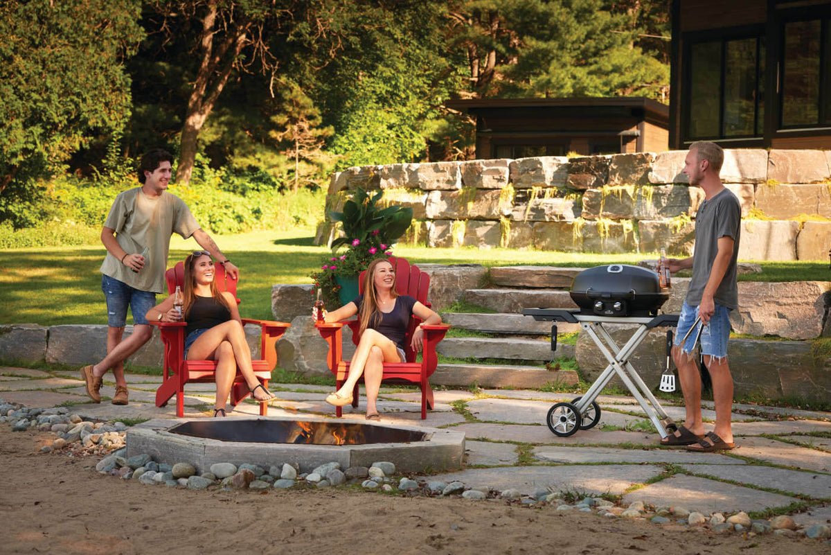 Napoleon TravelQ PRO285X Propane Grill with Scissor Cart - Napoleon portable outdoor grill product and lifestyle image