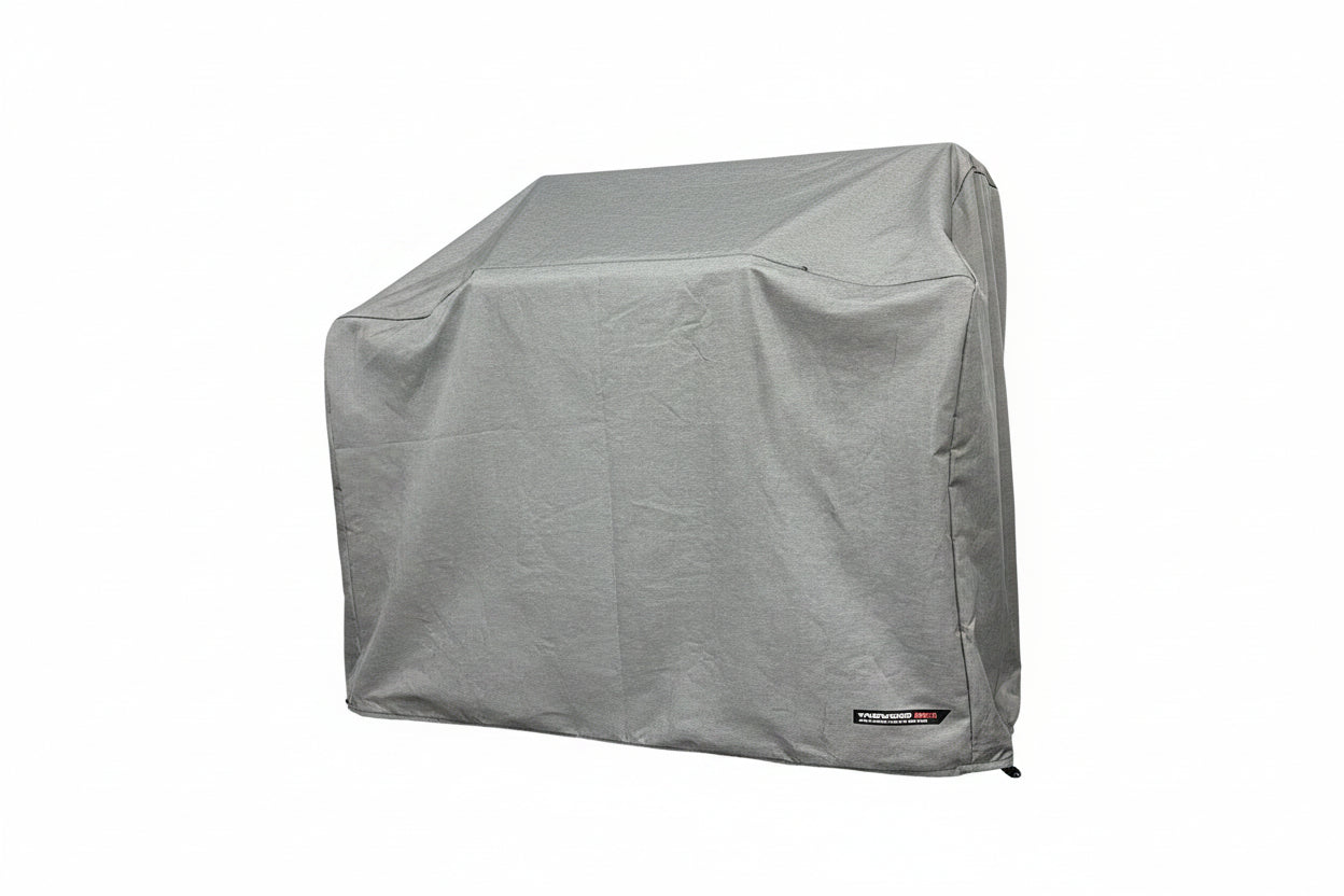 A gray cover protects the grill - smokeforges