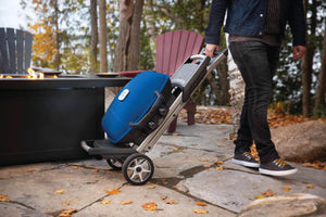 Napoleon TravelQ 285X Propane Grill with Scissor Cart - Blue - Napoleon portable outdoor grill product and lifestyle image