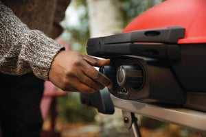 Napoleon TravelQ 285X Propane Grill with Cart & Griddle - Red - Napoleon portable outdoor grill product and lifestyle image