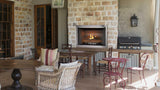 Majestic Vesper outdoor gas fireplace in a stacked stone wall
