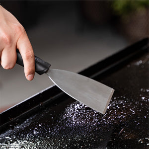 Blackstone Cleaning Kit — scraper in use