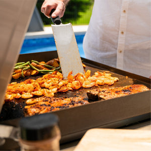 Blackstone Select 28-Inch XL Griddle with Cabinet — spatula and cooking surface close-up