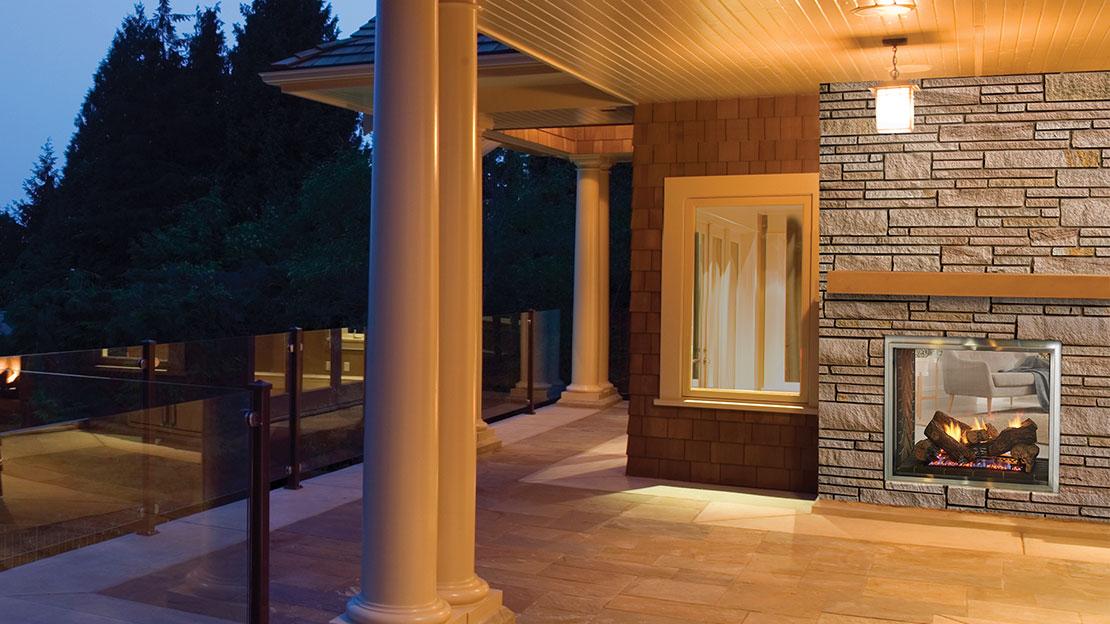 Majestic Fortress see-through gas fireplace, outdoor side on a patio