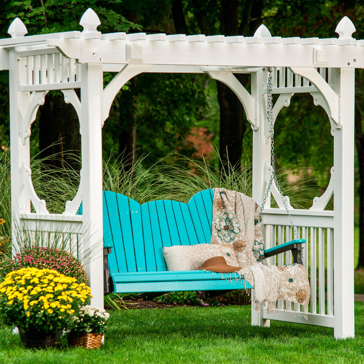 Luxcraft Five-foot Adirondack swing suspended from a garden structure