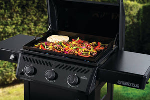Napoleon Freestyle 24 gas griddle — Steel cooktop preparing fajitas