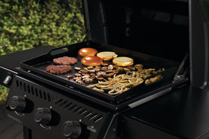 Napoleon Freestyle 24 gas griddle — Cooktop with burgers and vegetables