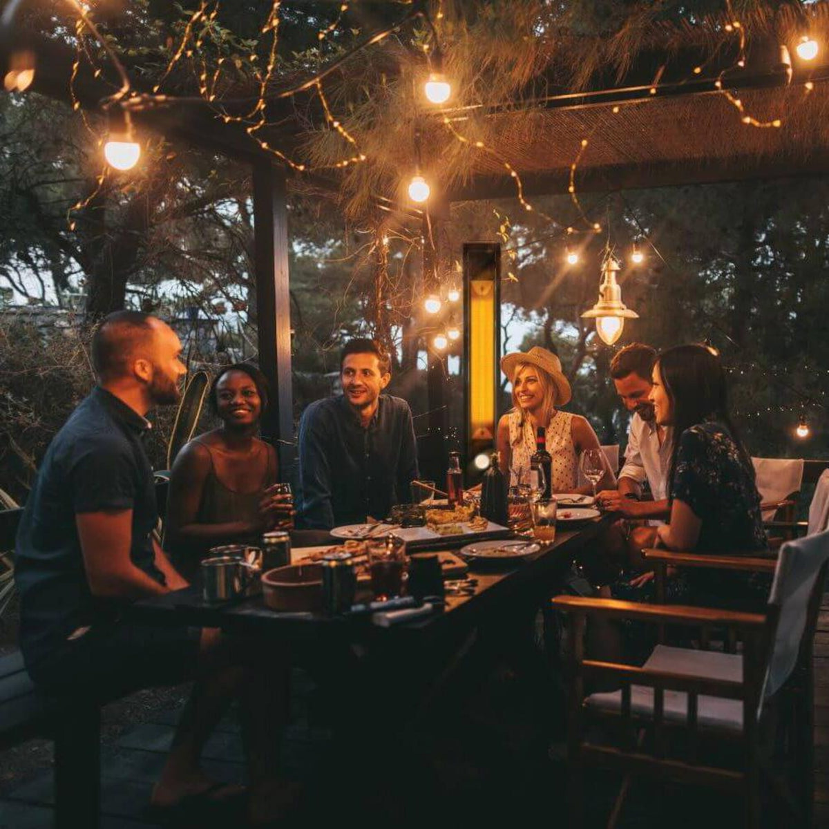 Napoleon NEOFV80IH Phantom Freestanding 1500W Electric Infrared Patio Heater - At Night - Lifestyle